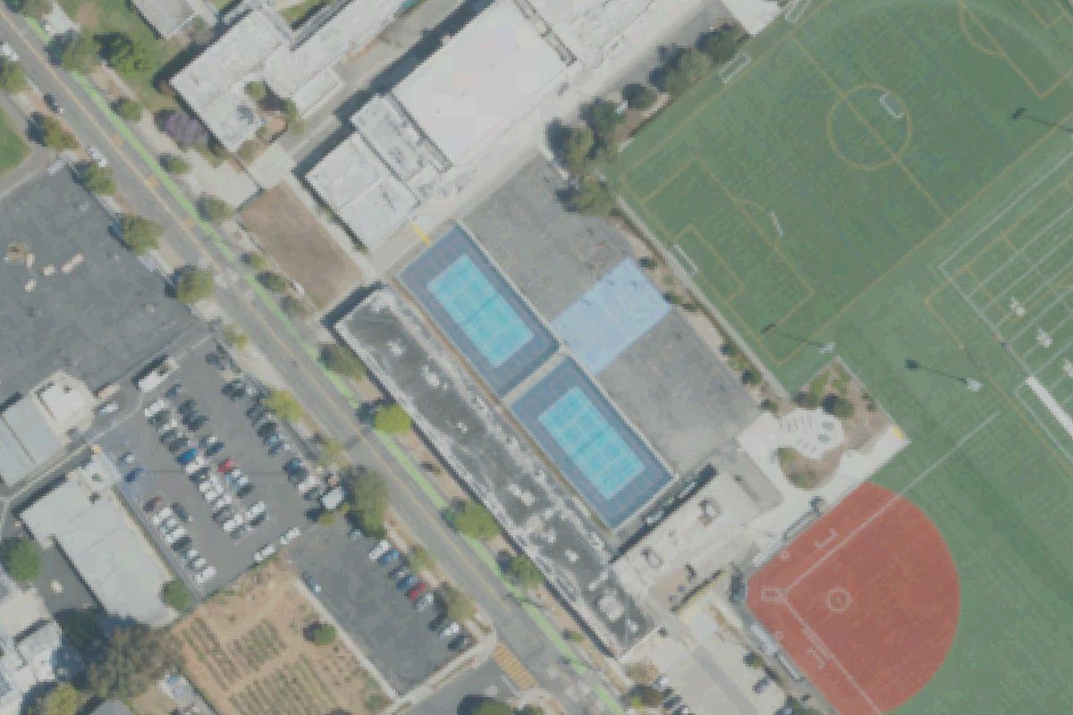 Aerial photo of John Adams Middle School from May 11, 2022, with the outdoor courts outlined.