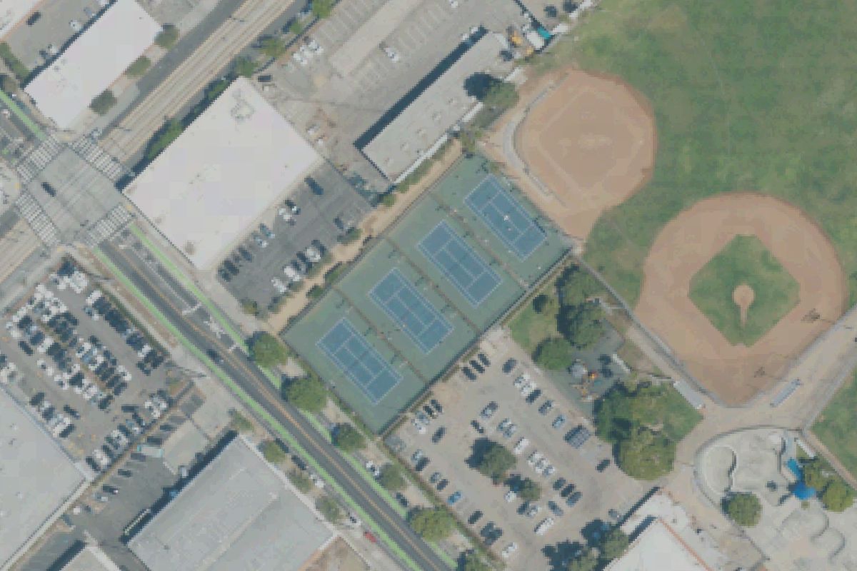Aerial photo of Memorial Park from May 11, 2022, with the tennis courts with pickleball lines outlined.